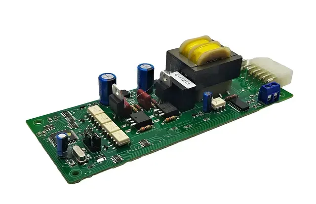 Electronic circuit board with transformer, capacitors, and connectors on a green PCB