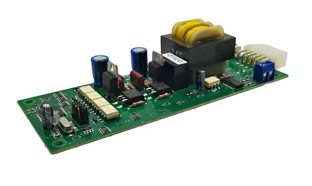 Green electronic circuit board with capacitors, transformers, and connectors