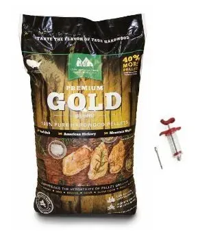 Black premium pet food bag with gold lettering, beside a small red-and-white dog toy