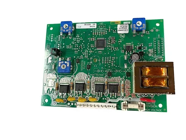 Green electronic circuit board with blue components and copper coil