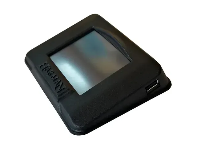 Black handheld electronic device with a small screen and rounded edges on a white background