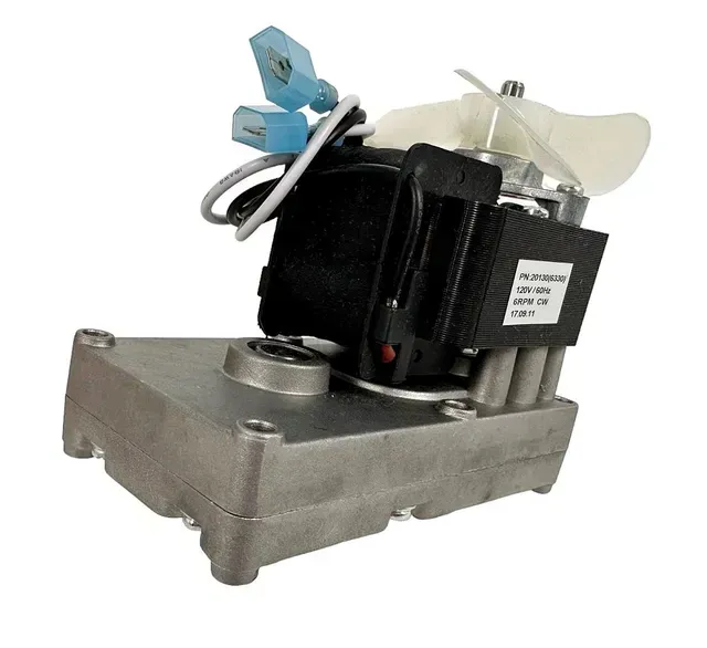 Black motor assembly on a gray metal base with wires and a white fan blade