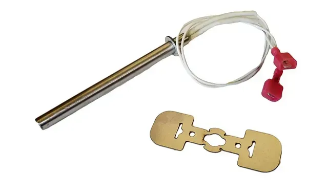 Metal tool with a coiled white cord and red caps beside a small brass connector plate