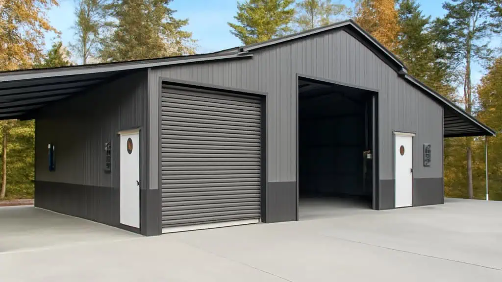 Dark gray garage with open bay and rolling door, white doors, and carport in a wooded setting.