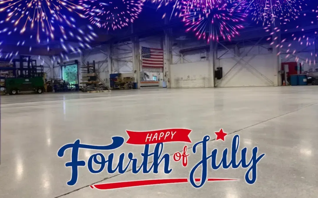 “Happy Fourth of July” sign in a warehouse under blue fireworks decorations