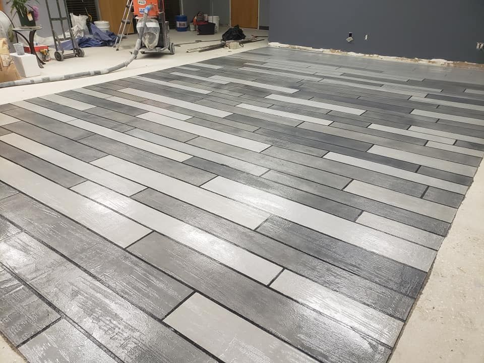 a large wooden floor with a vacuum cleaner on it
