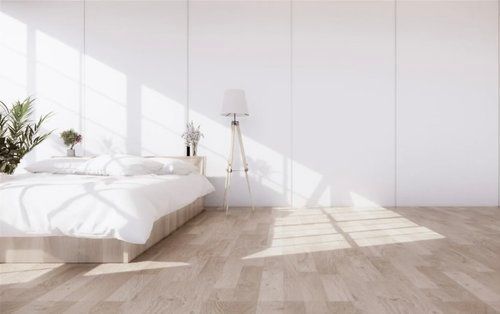 a Bedroom With a Bed, Lamp, and White Walls — The Home Assembly In Avoca Beach, NSW