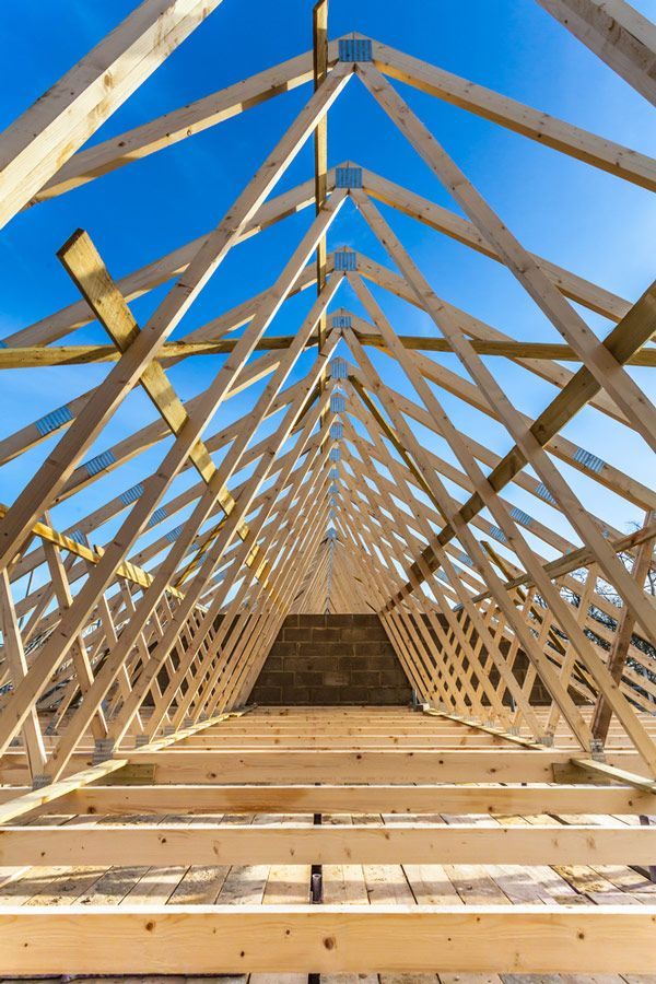 Wood House Truss Against Blue Sky — Elliott Timber Sales Pty Ltd in Ryan, QLD
