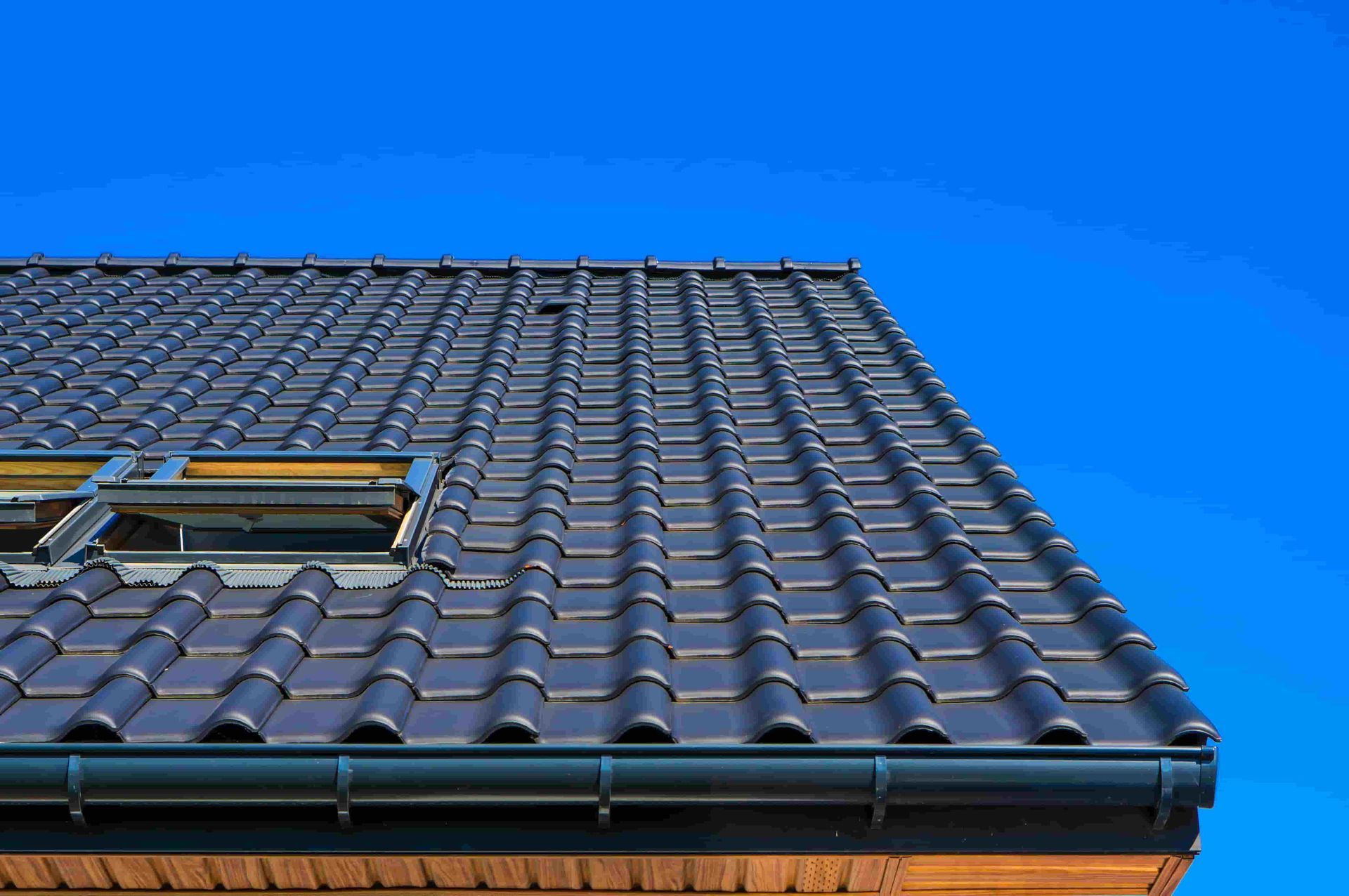 Vertical low angle closeup shot of the black roof of a building — Elliott Timber Sales Pty Ltd in Ryan, QLD