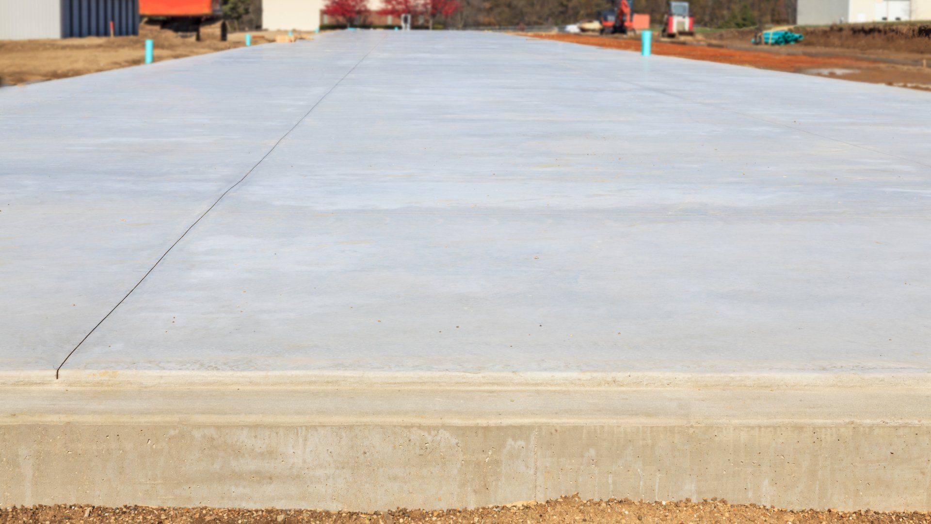 Long, narrow view of a concrete slab on grade.
