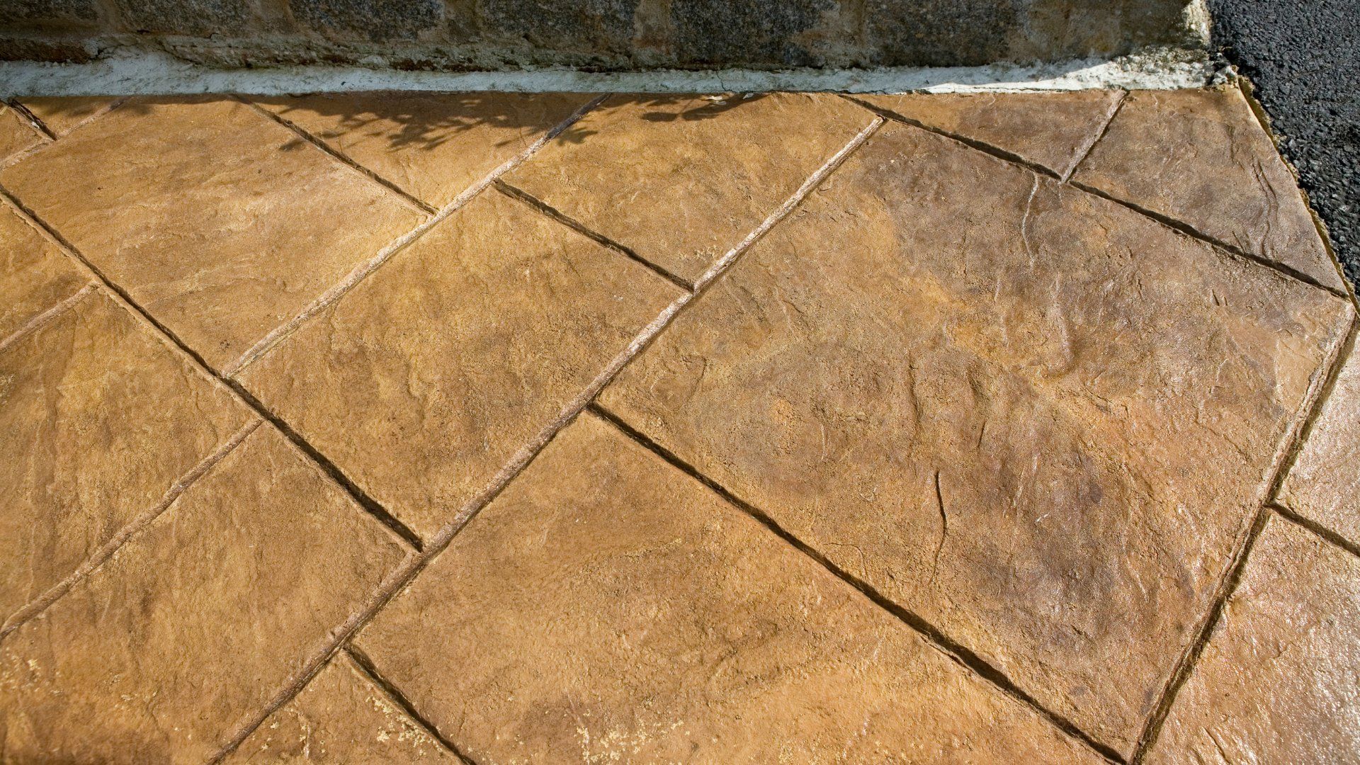 Concrete patio with block stamp patterns.