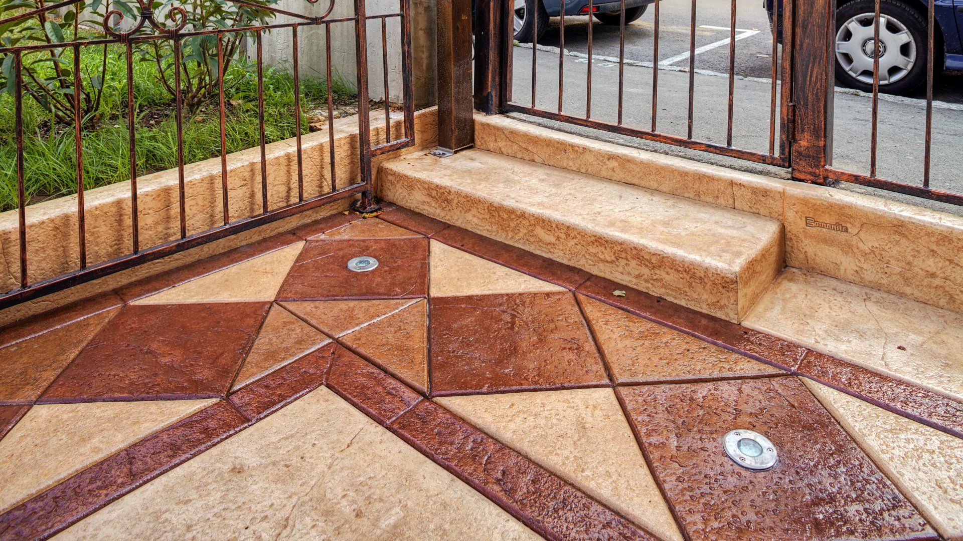 Textured and coloured concrete in the front patio of a building in Peterborough Ontario.