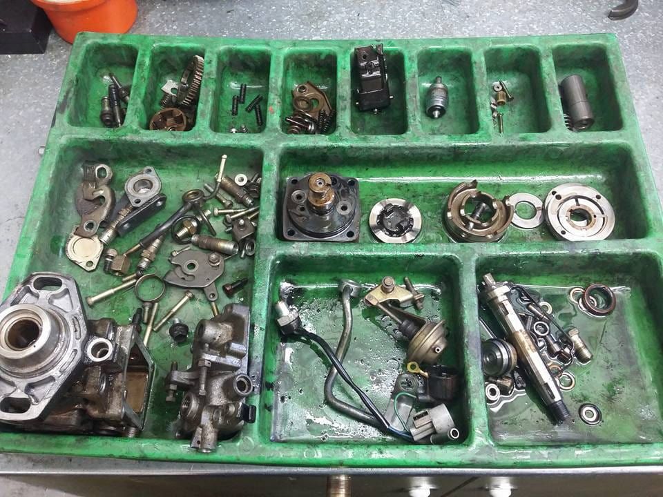 A Green Tray Filled With Lots of Different Types of Parts — Whitsunday Diesel & Marine In Rockhampton, QLD