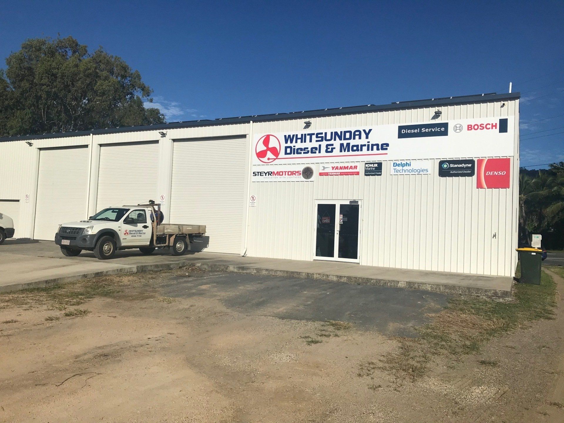 A White Truck is Parked in Front of a White Building — Whitsunday Diesel & Marine In Jubilee Pocket, QLD