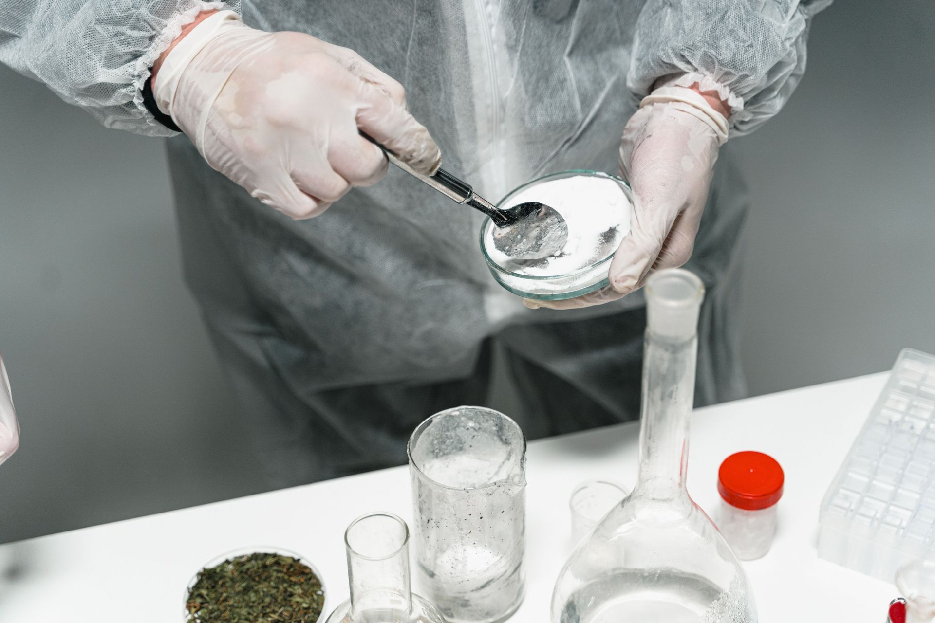 Apex Powder Coating worker applying durable powder to metal parts during a Show Low, Arizona project