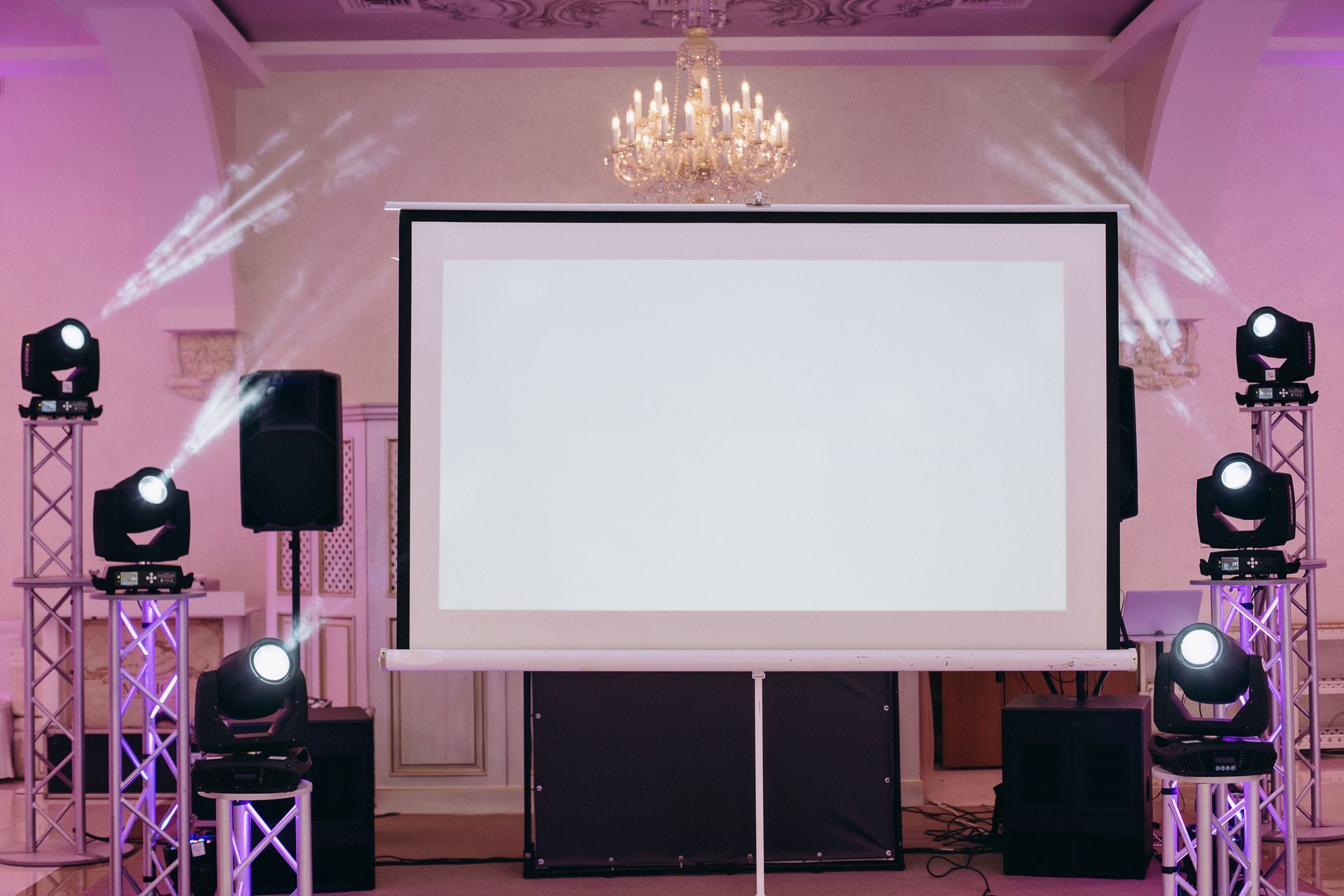 There is a projector screen in the middle of the room.