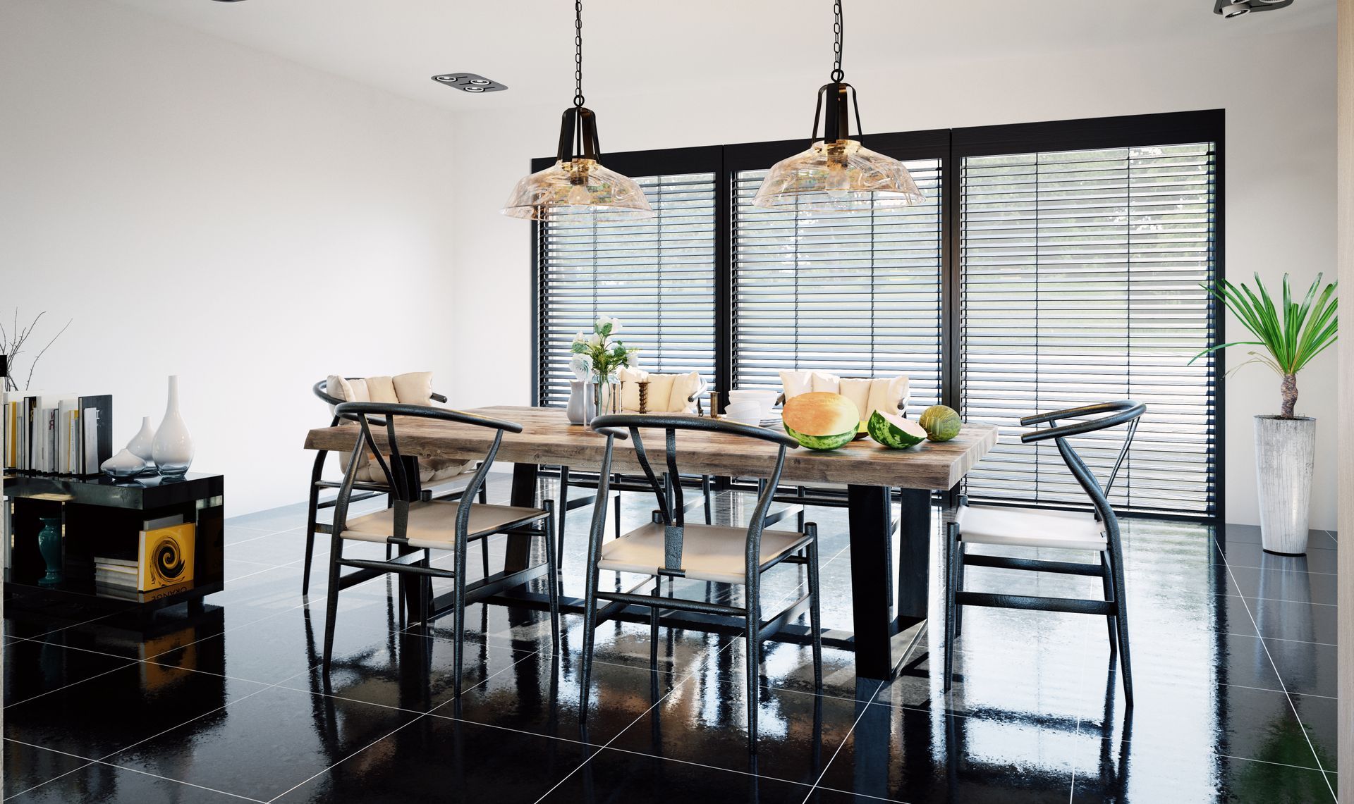 Modern dining room with black table, woven chairs, pendant lights, and potted plants on glossy tile floor