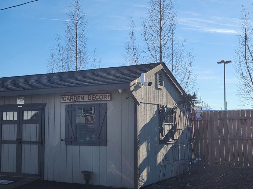 Small beige building labeled 