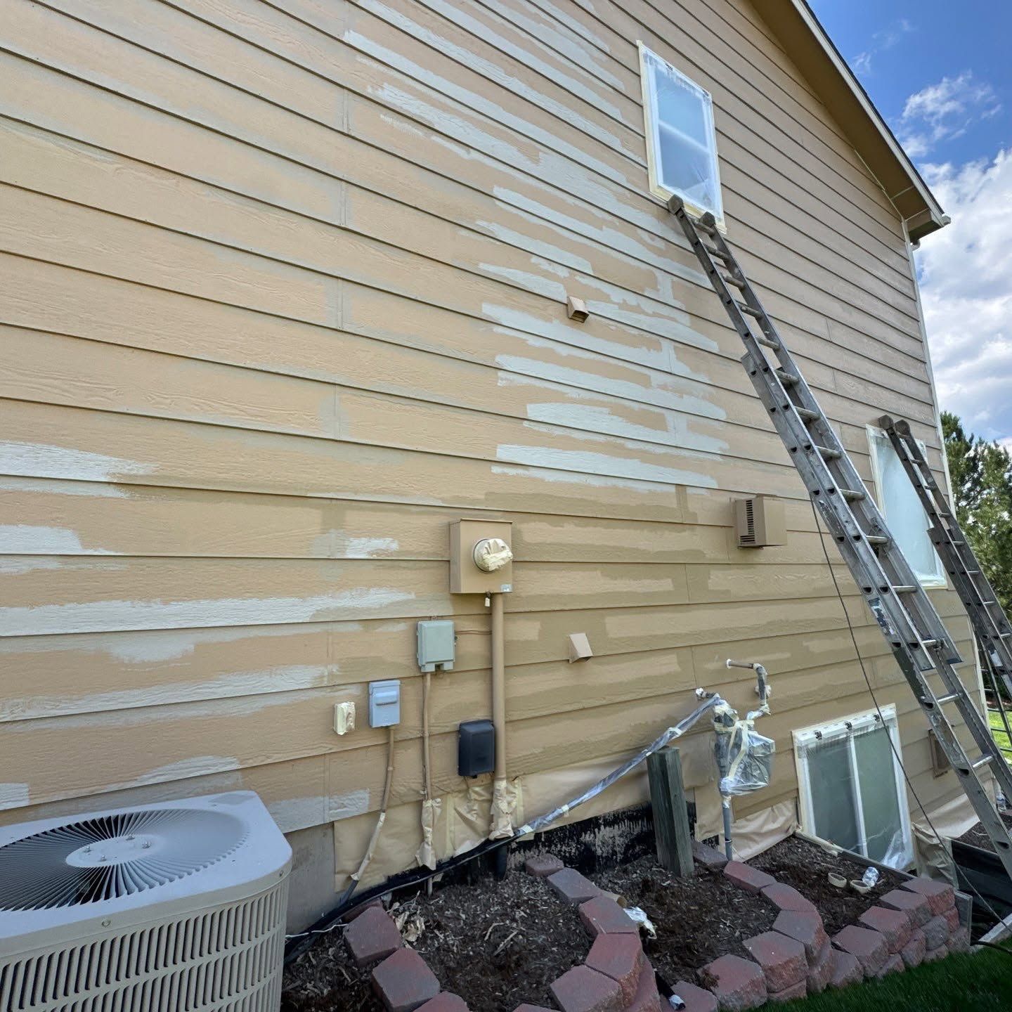 Siding preparation during Carroll Painting's Herbal Wash exterior project