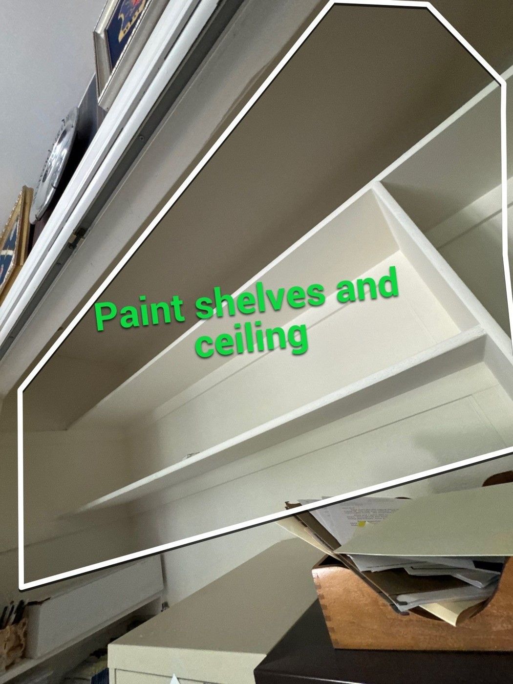 Closet shelves and ceiling marked for painting in a separate Carroll estimate