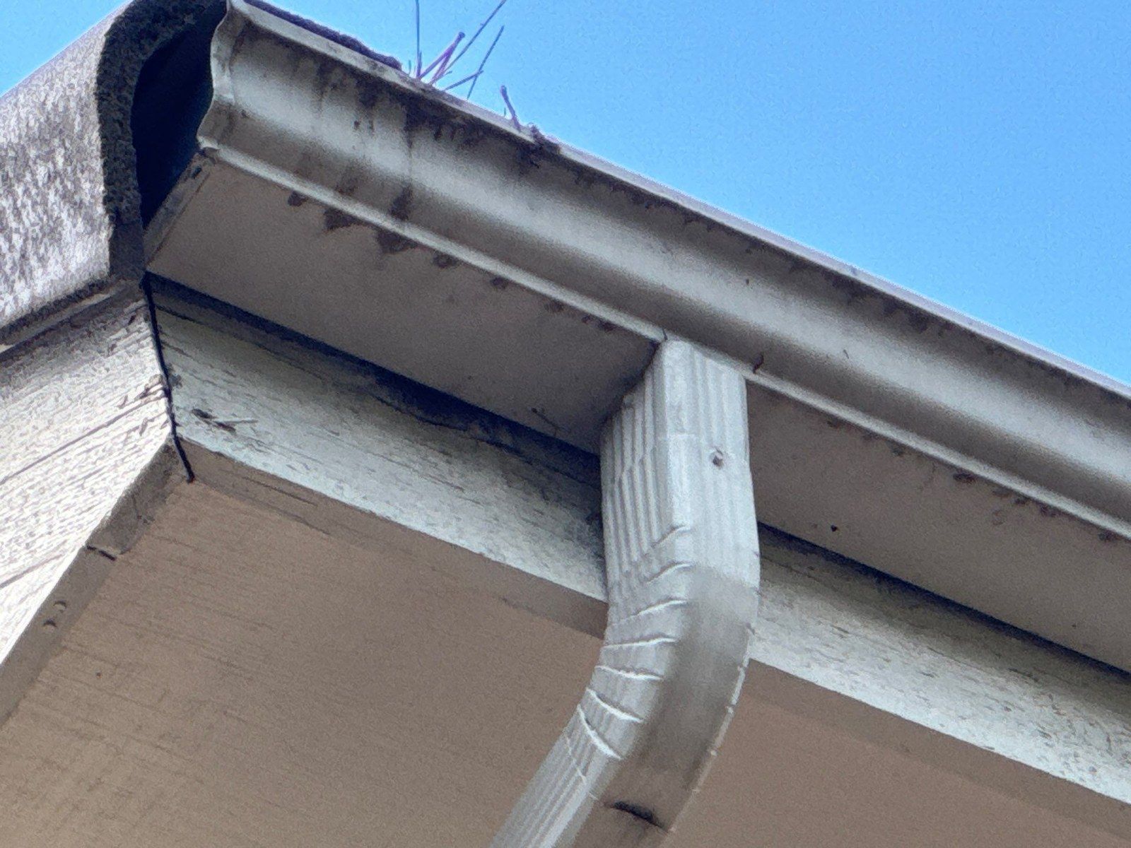 Gutter, downspout connection and soffit detail at the same Colorado Springs home