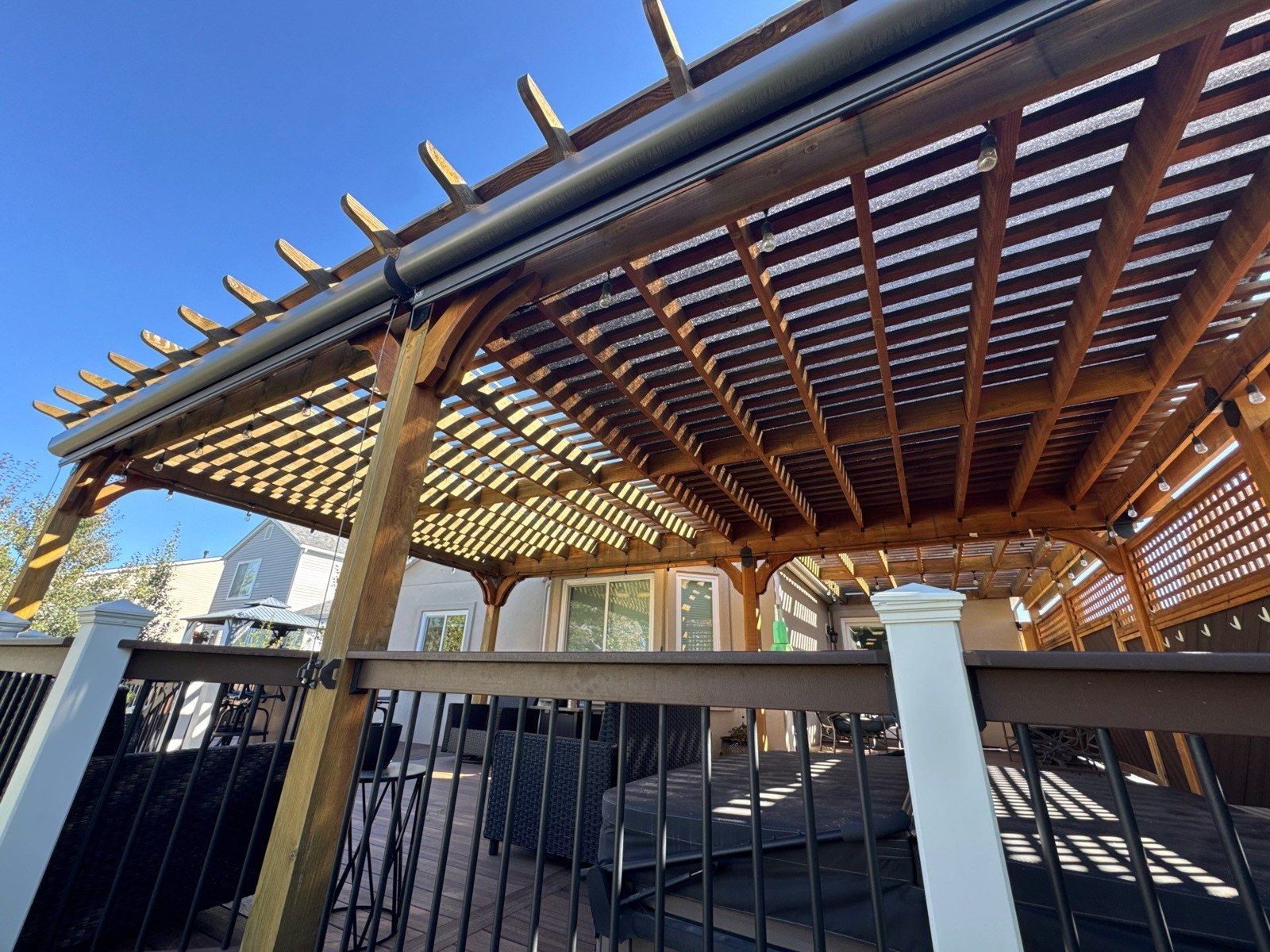 Existing wood pergola above an occupied deck at the Colorado Springs property in this estimate