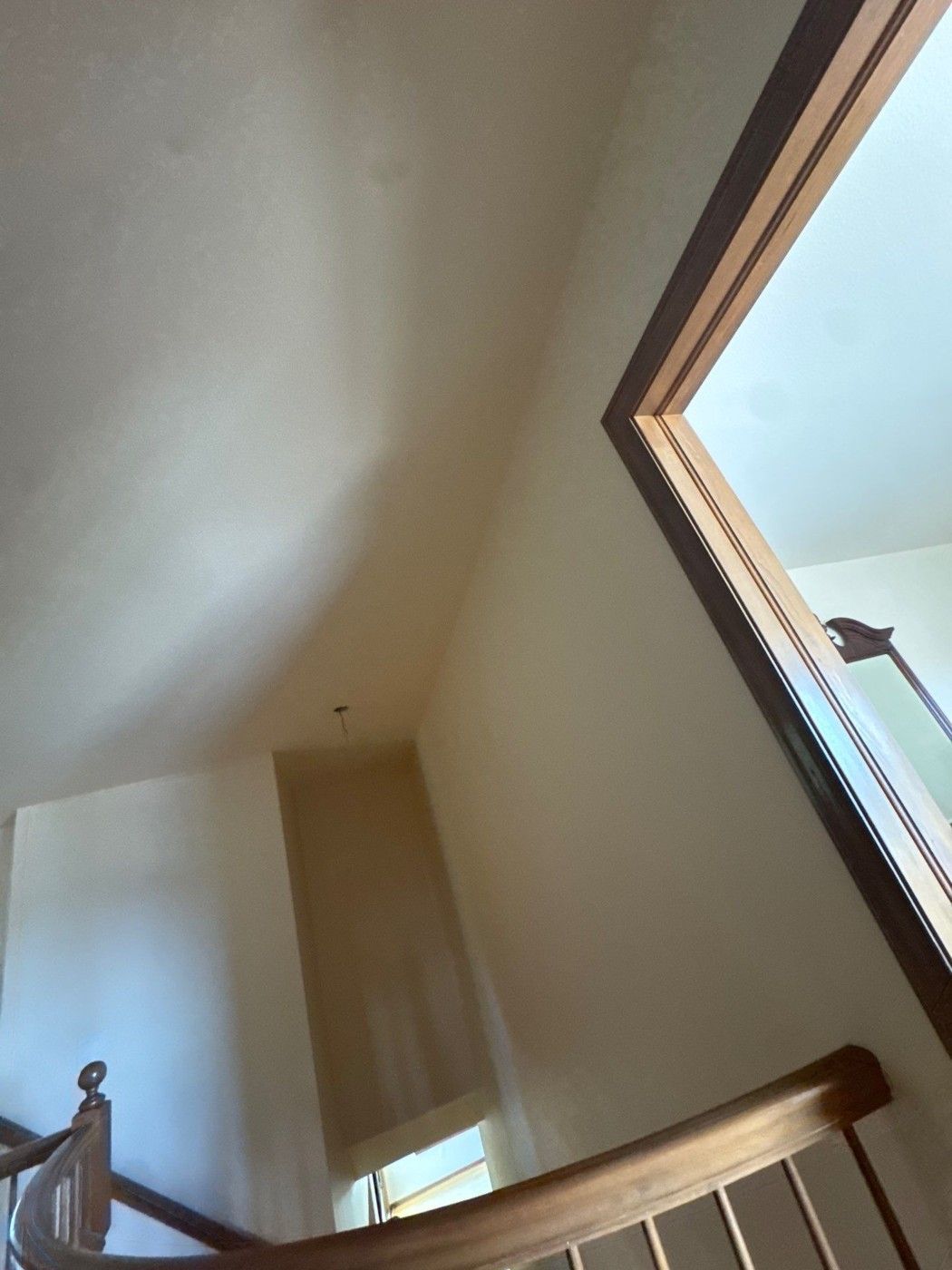 Existing stairwell ceiling and adjacent wall opening in a Colorado Springs estimate