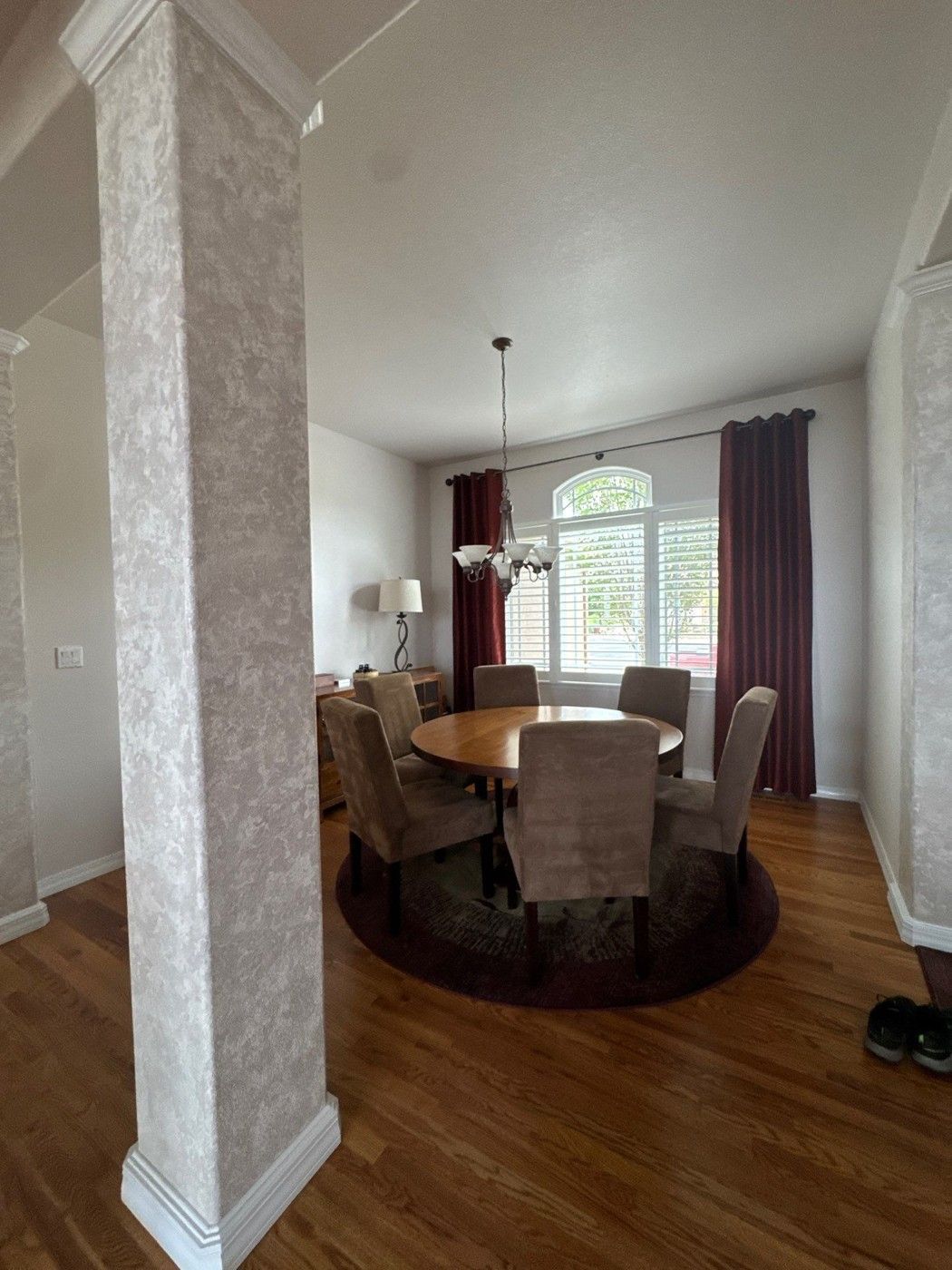 Connected dining space with openings and architectural details in a Colorado Springs wall-painting estimate