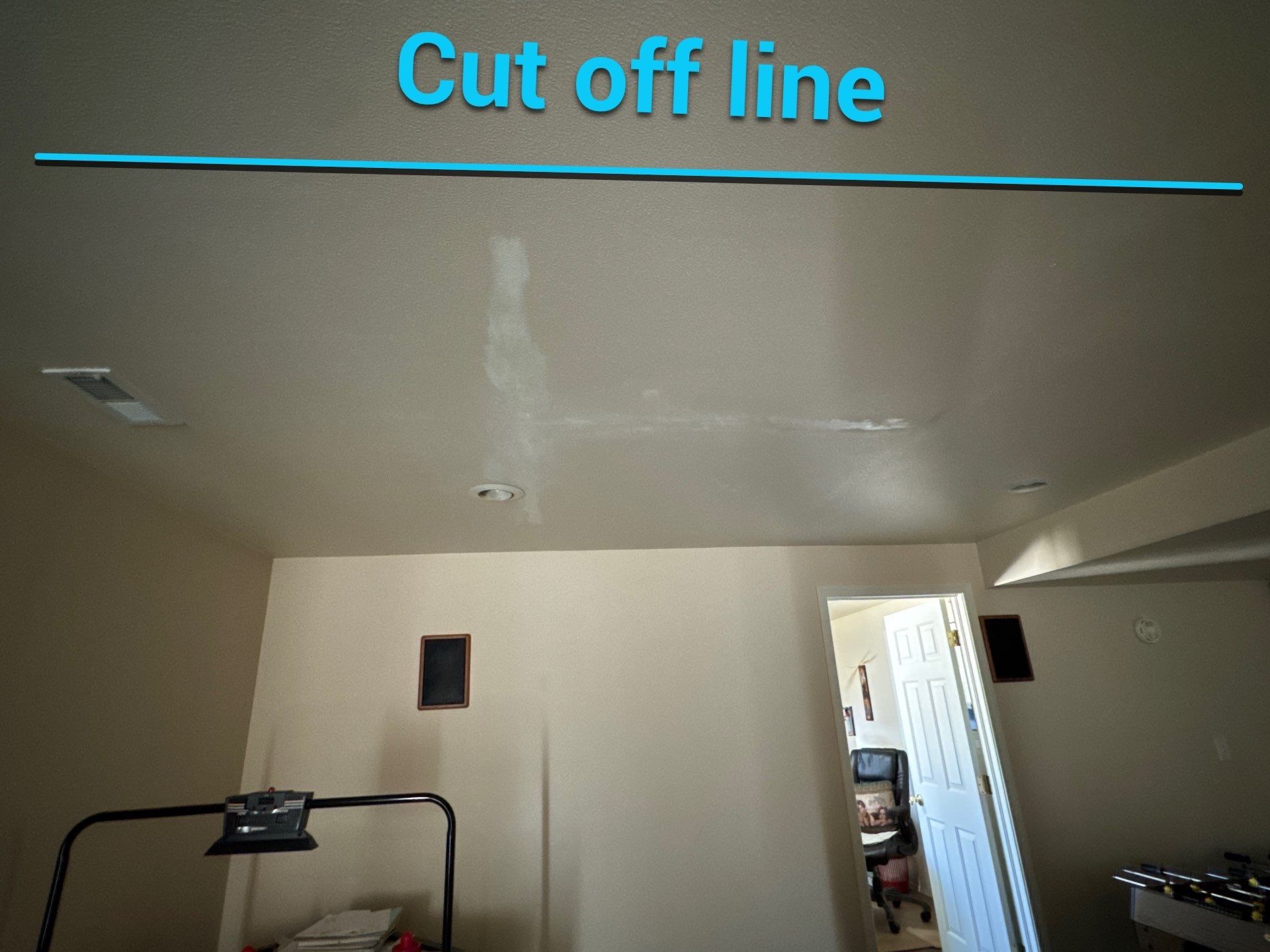 Basement ceiling photograph from the same estimate with a cutoff line marking the proposed painting boundary