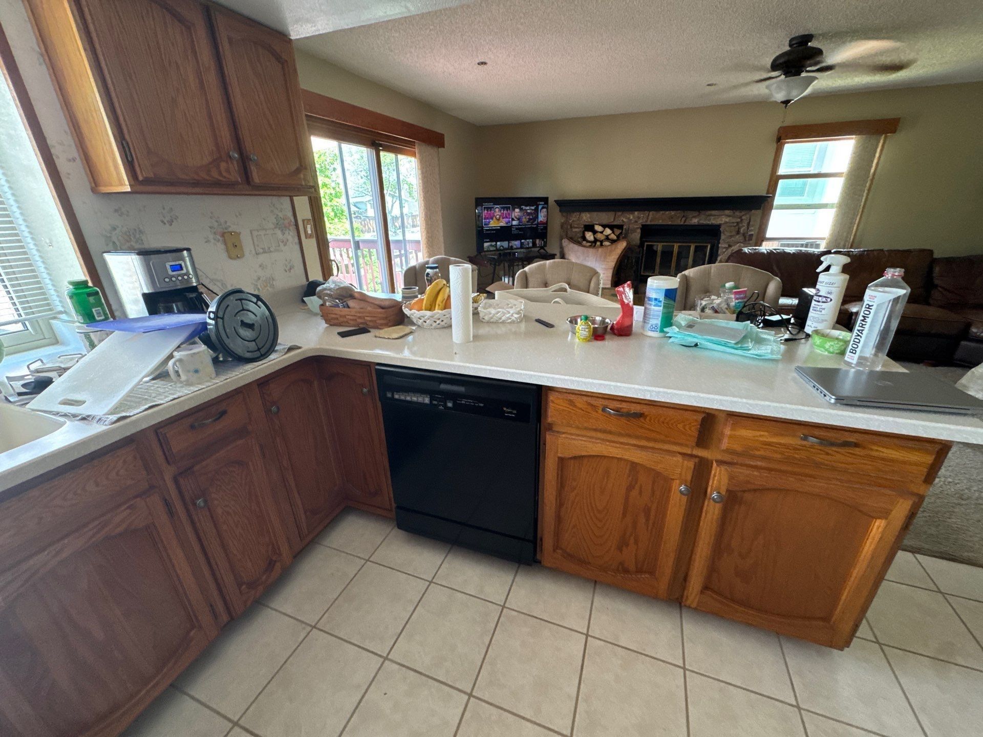 Existing wood kitchen cabinets and tiled floor at the same Colorado Springs 80920 home