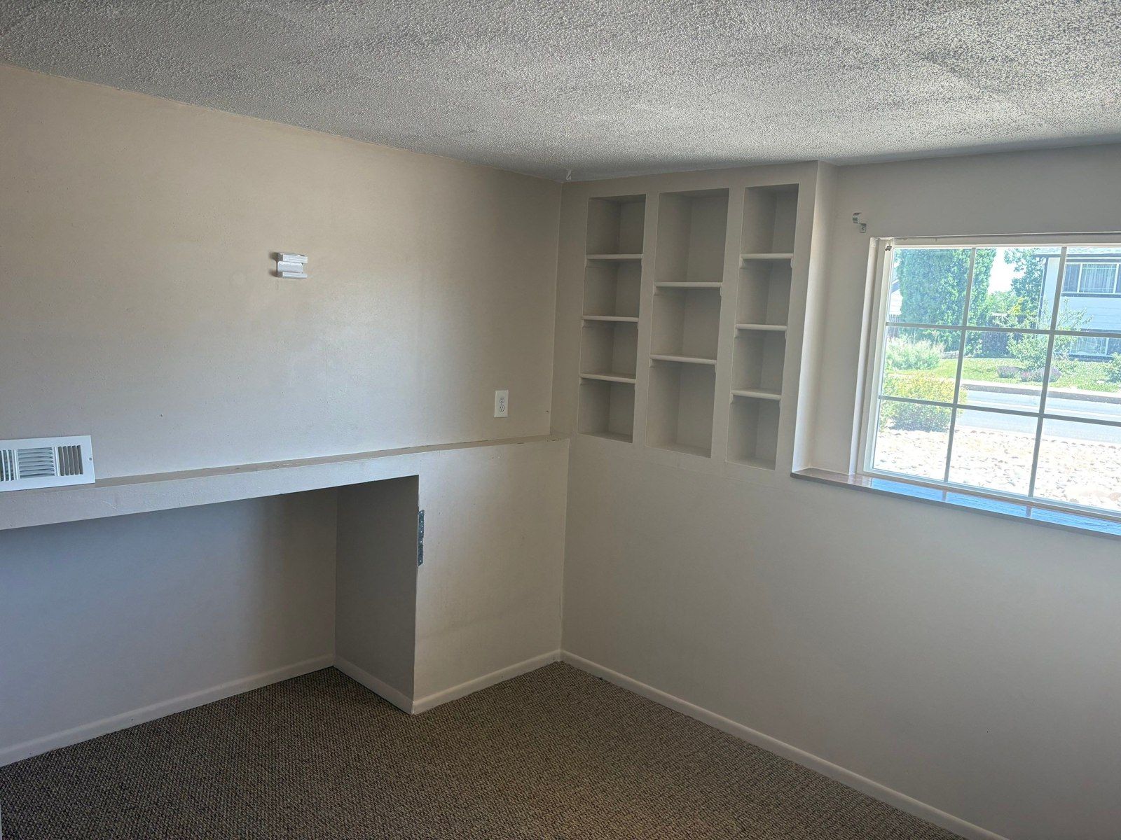 Existing interior room with walls, windows and built-in features in the same project