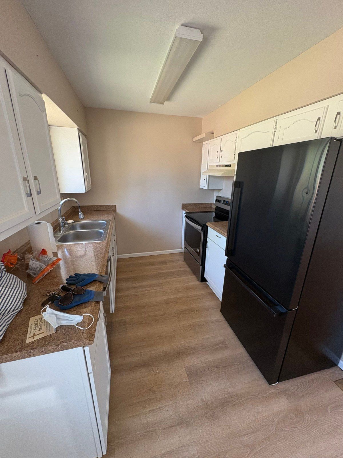 Kitchen with existing wall and ceiling surfaces, cabinets and flooring in the same interior estimate