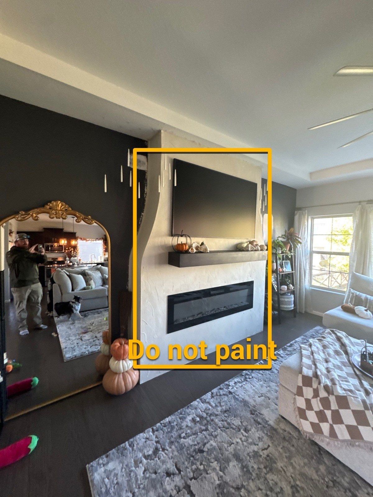 Actual project photo with the fireplace area outlined and marked Do not paint