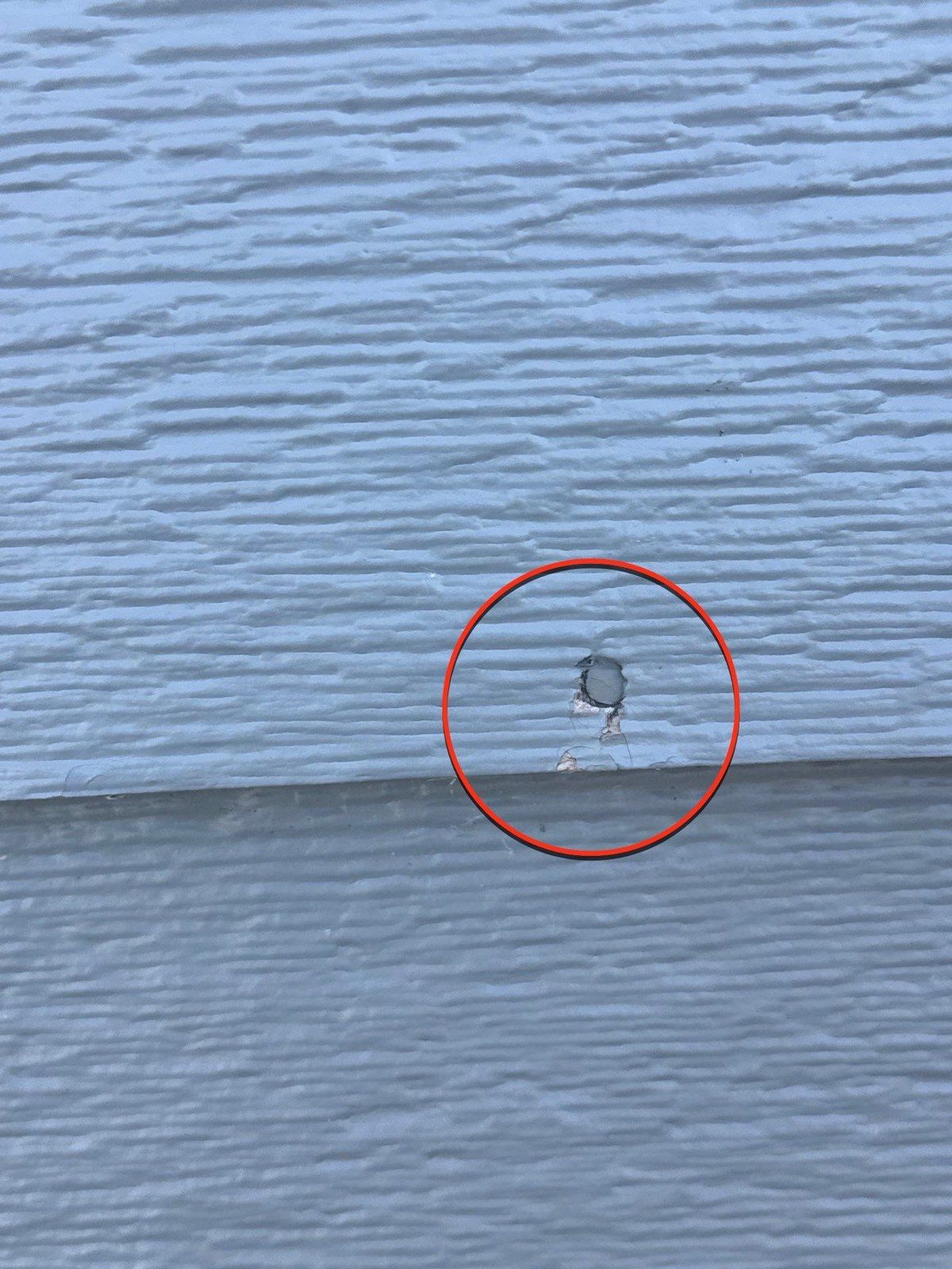 Red-circled spot on existing lap siding in the same Fountain exterior painting estimate