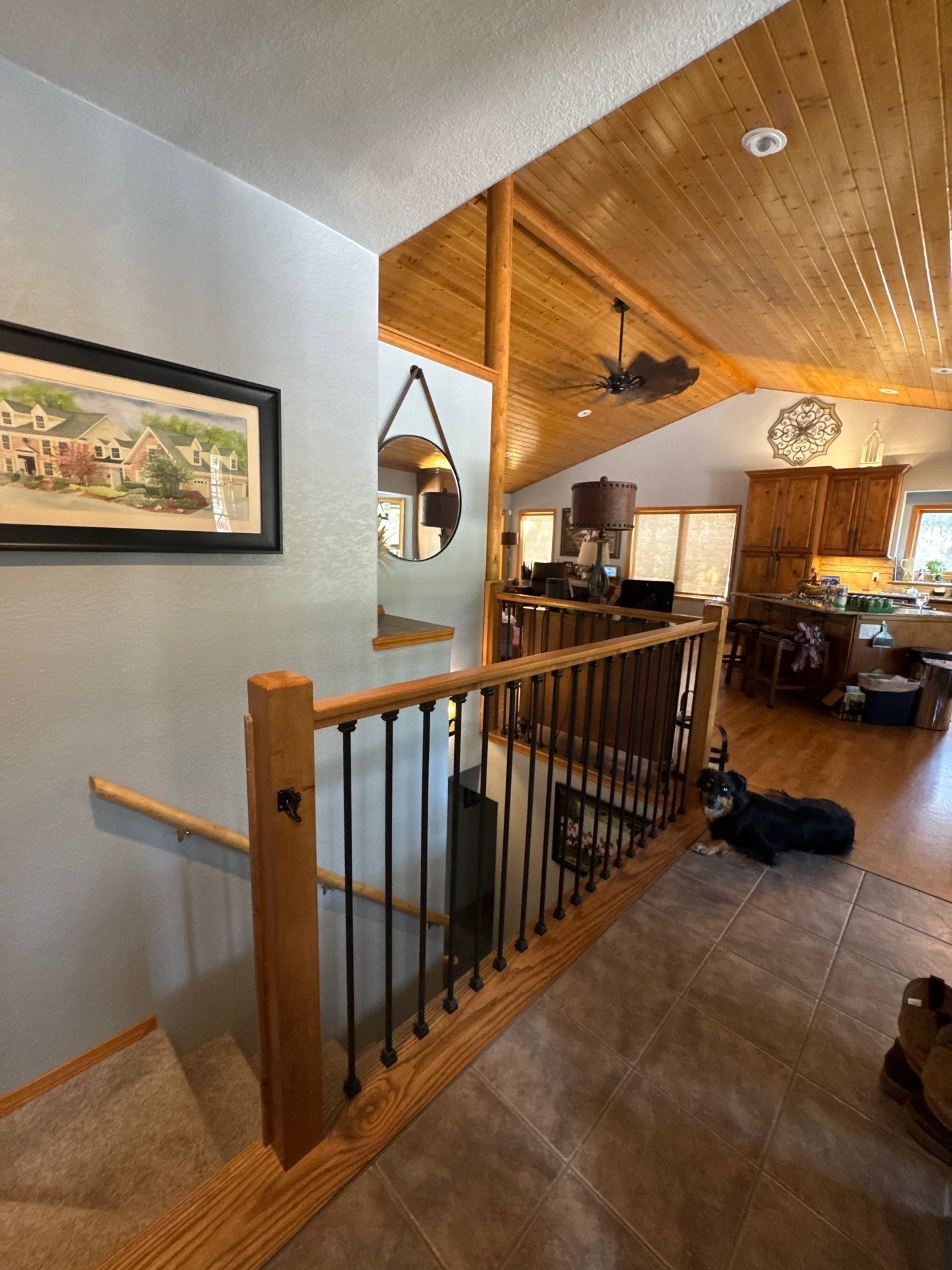 Wall beside retained-looking wood ceiling and stair railing in a Colorado Springs estimate photo