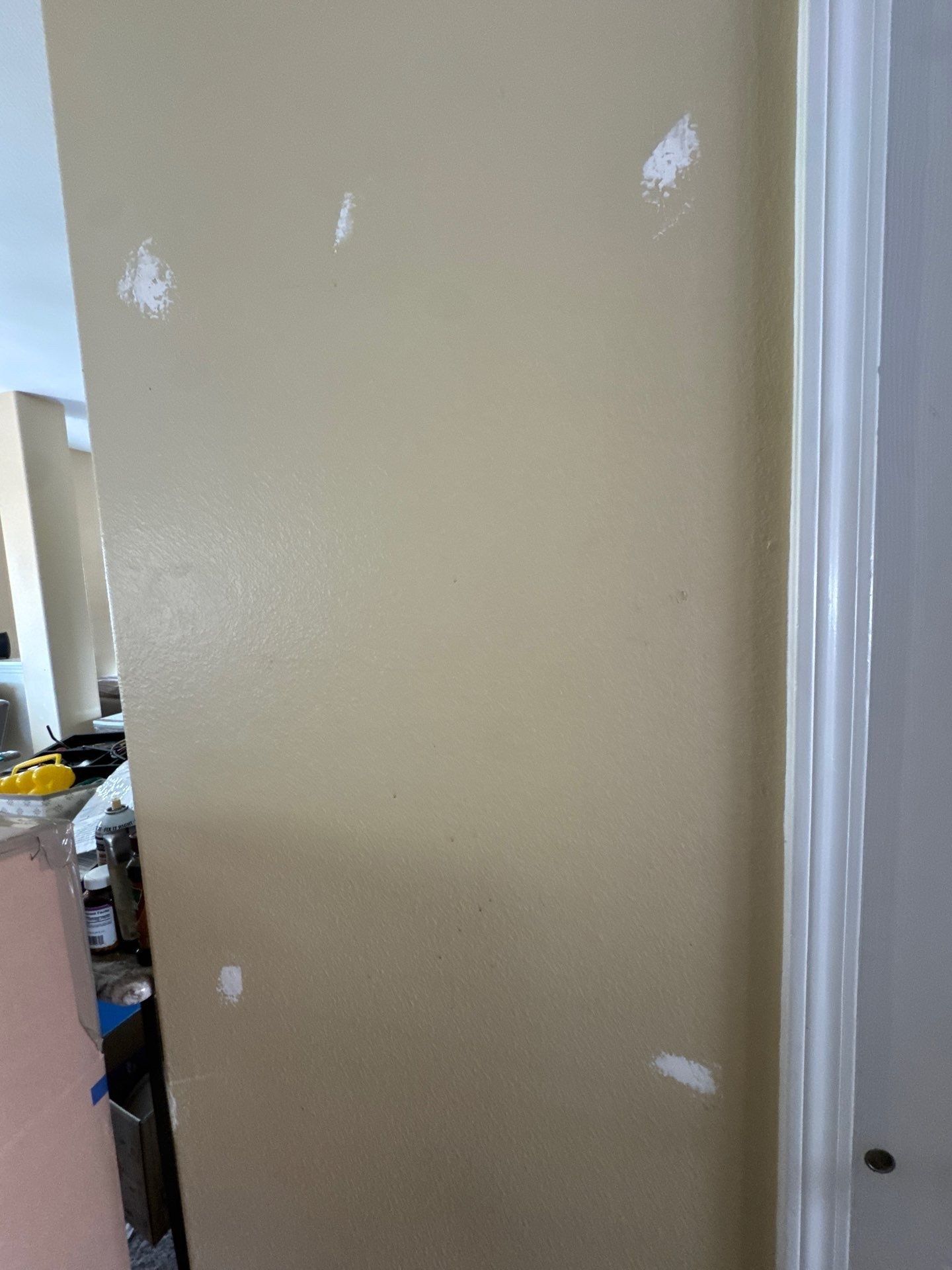 Wall with several visible patch locations in the Carroll Painting touch-up estimate