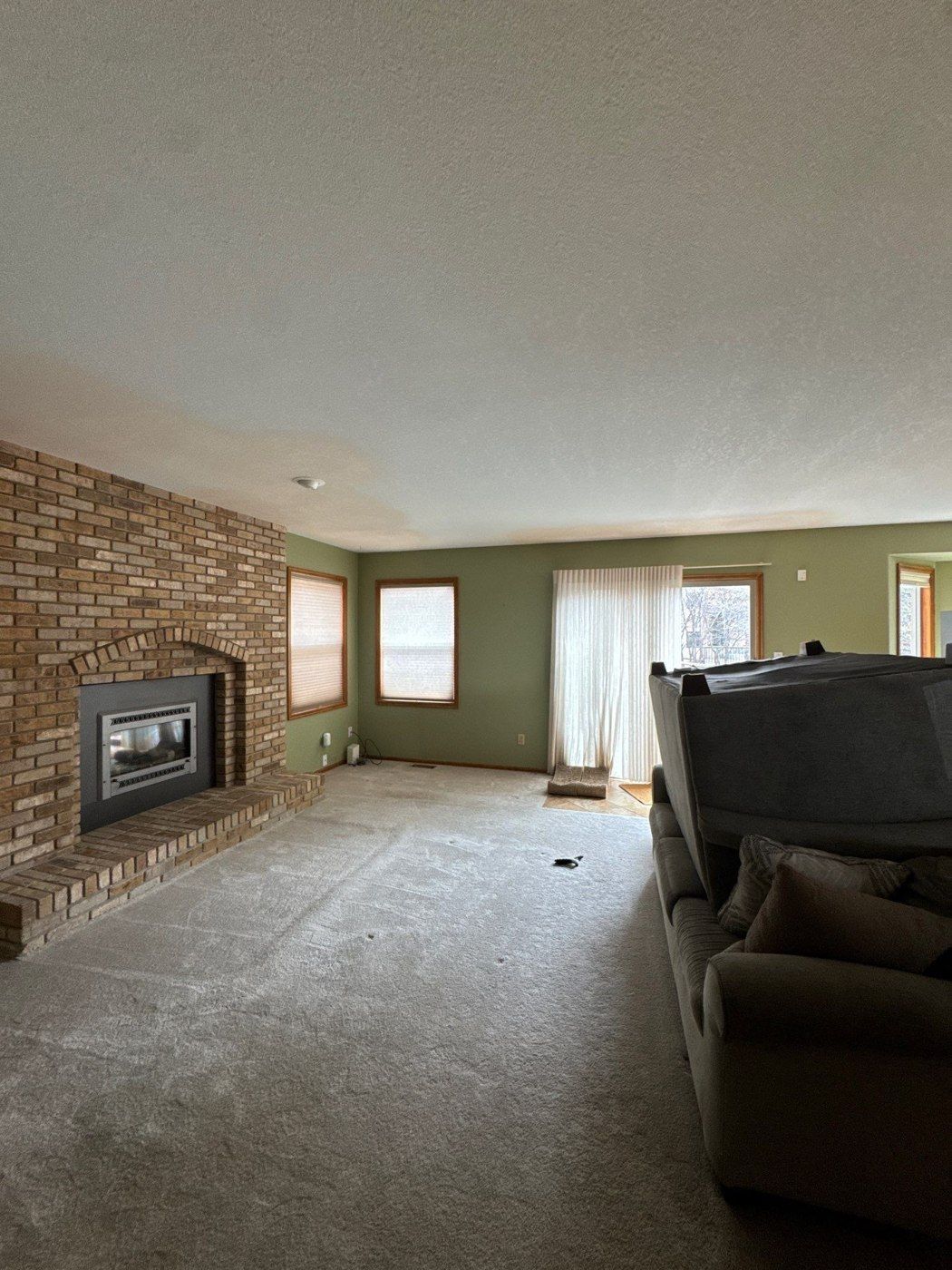 Living room with ceiling and wall transitions from the same Colorado Springs estimate