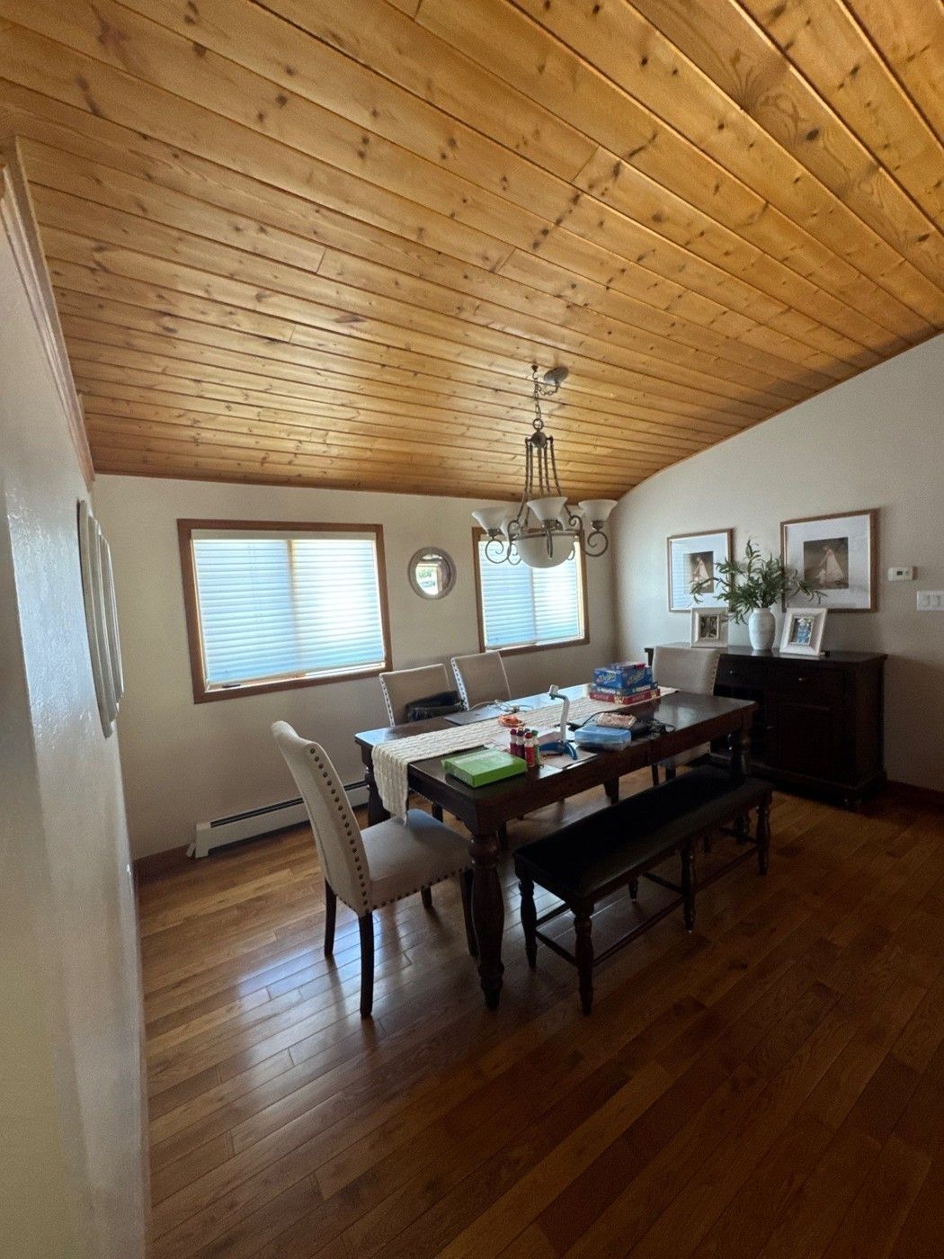 Dining space beneath an existing stained wood ceiling in the Monument estimate