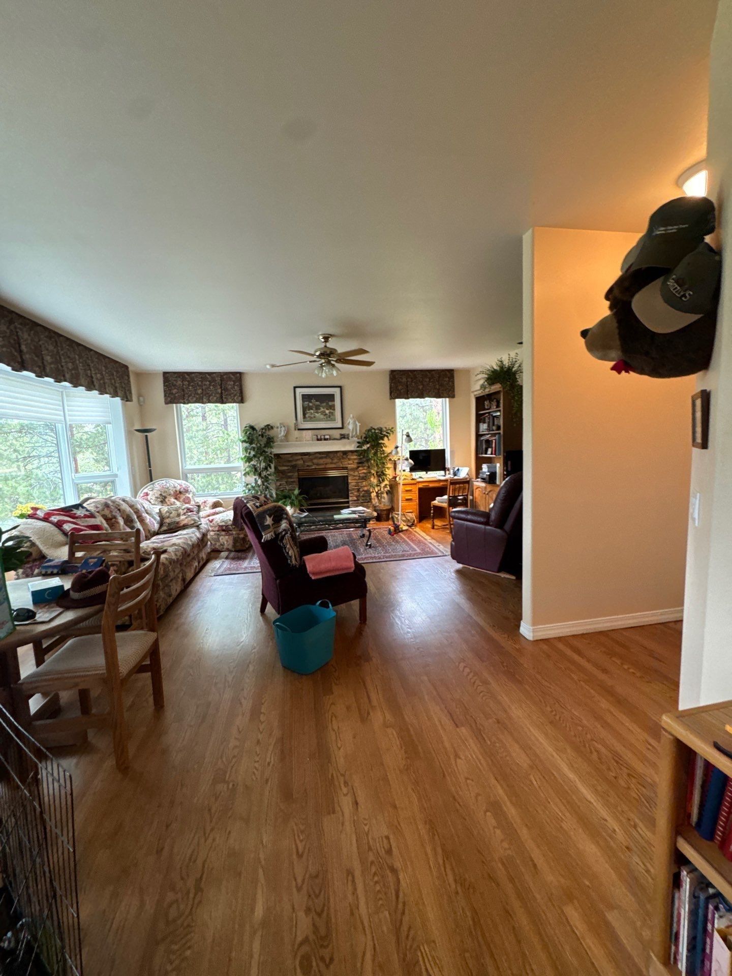 Furnished main living area with wood flooring in a Monument interior painting estimate