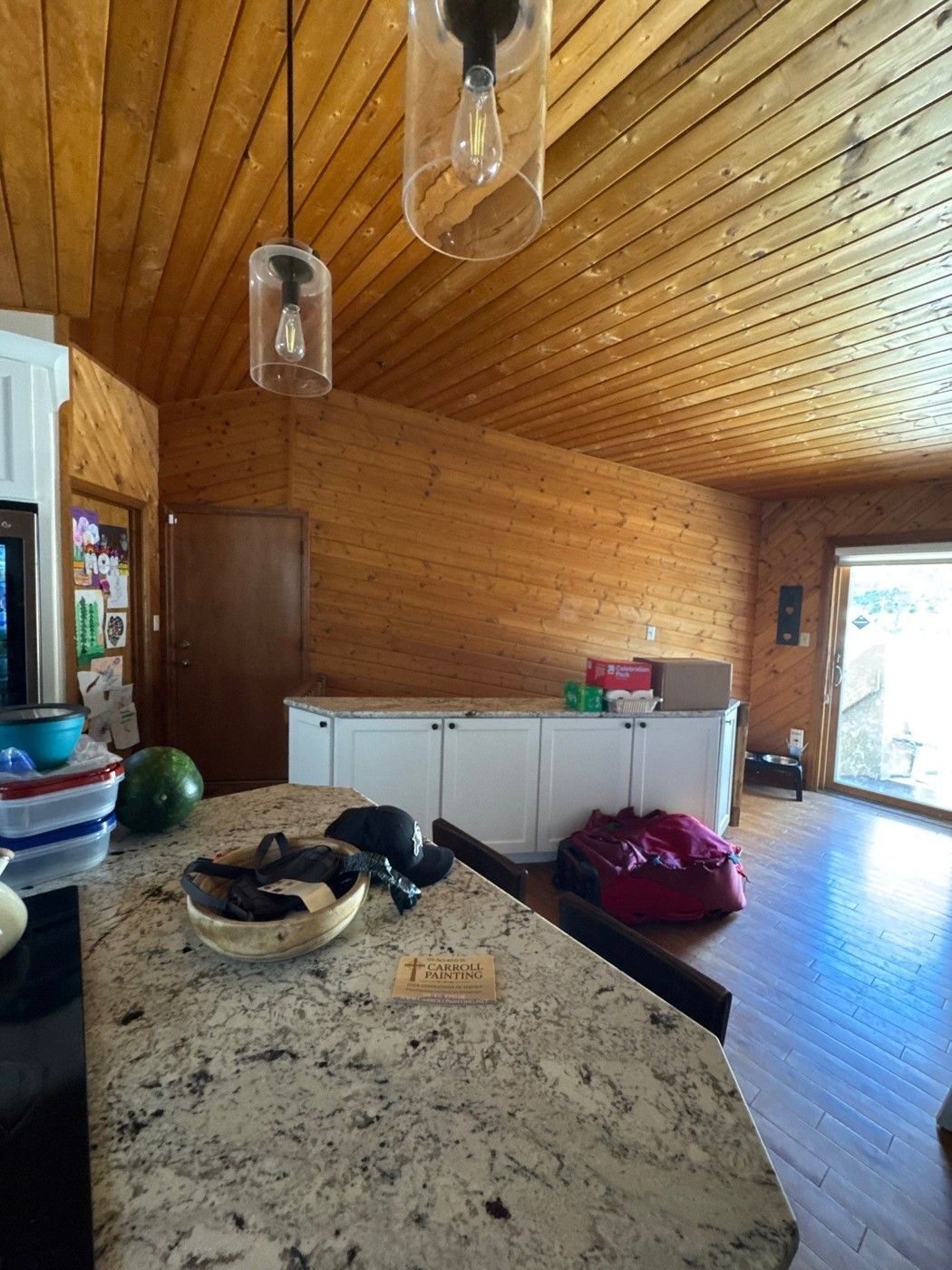 Living-area wood walls and stained wood ceiling photographed for a Monument interior estimate