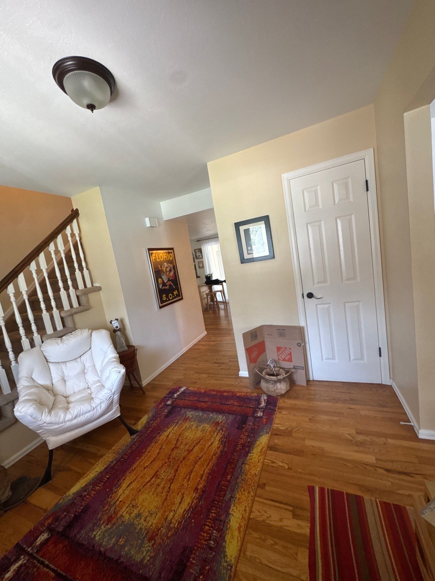 Foyer with entry door, interior doors and staircase in a Colorado Springs interior painting estimate