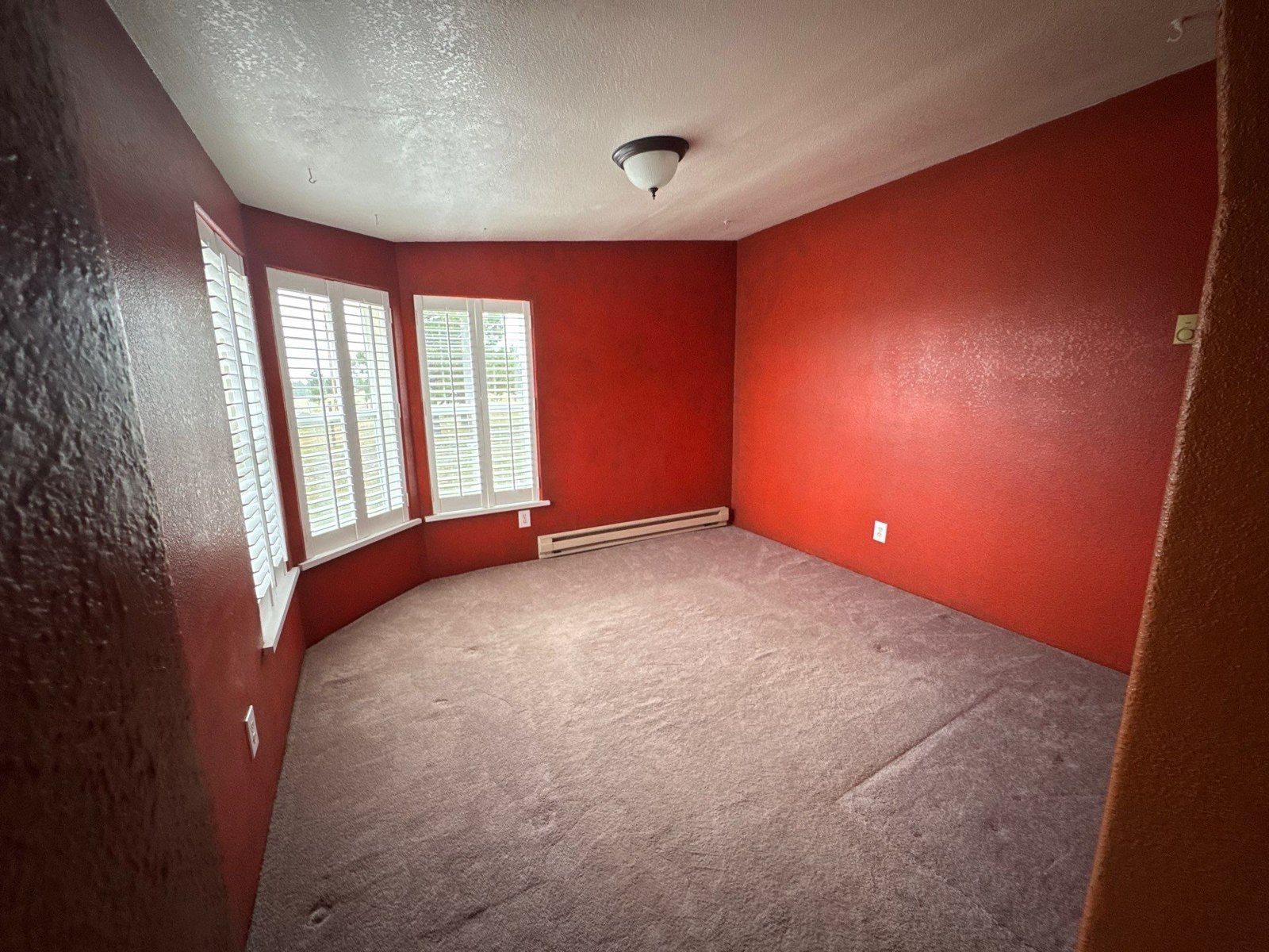 Room with red walls and a light ceiling in the same Peyton estimate photo set