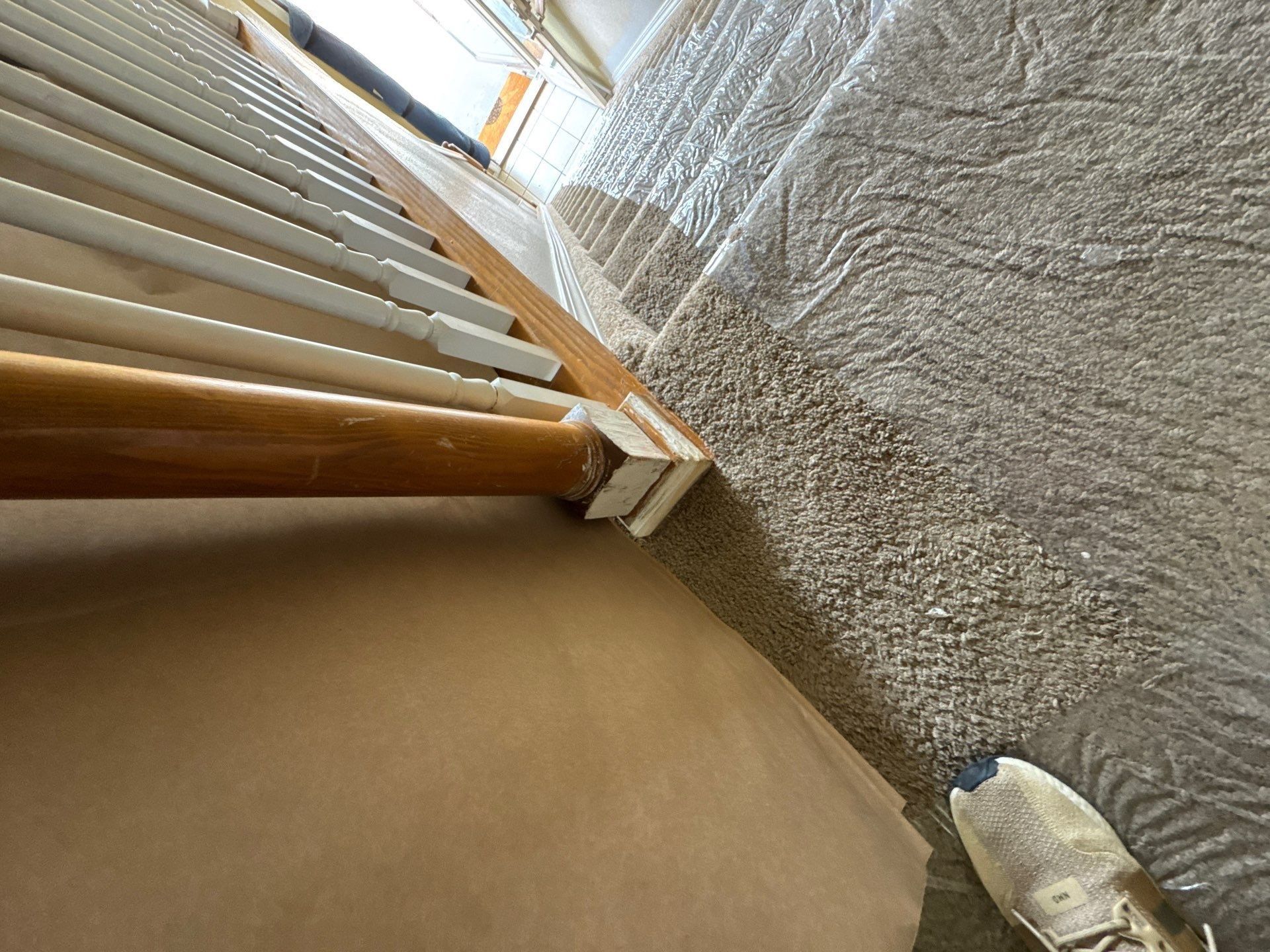 Close view of stair rail and spindles from the same Carroll Painting estimate