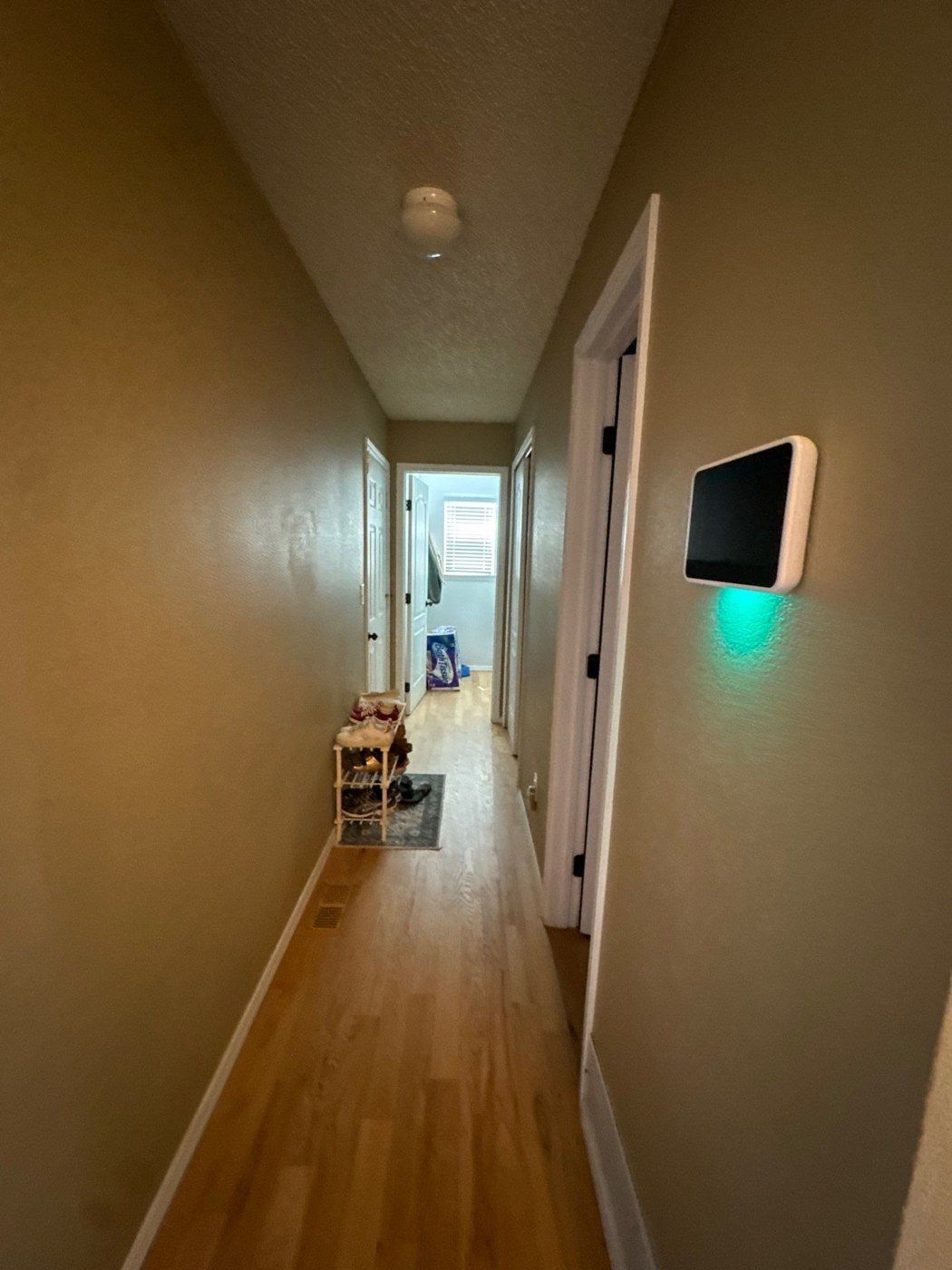 Hallway and door openings photographed for a three-level Colorado Springs interior painting estimate