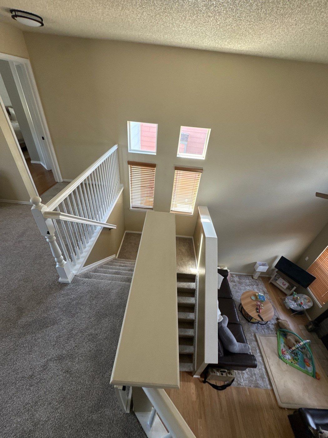 Stairwell connecting levels in a Colorado Springs interior painting project record