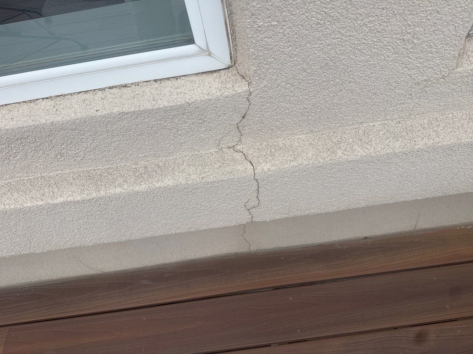 Visible line in stucco beneath a window opening in the same Colorado Springs exterior proposal