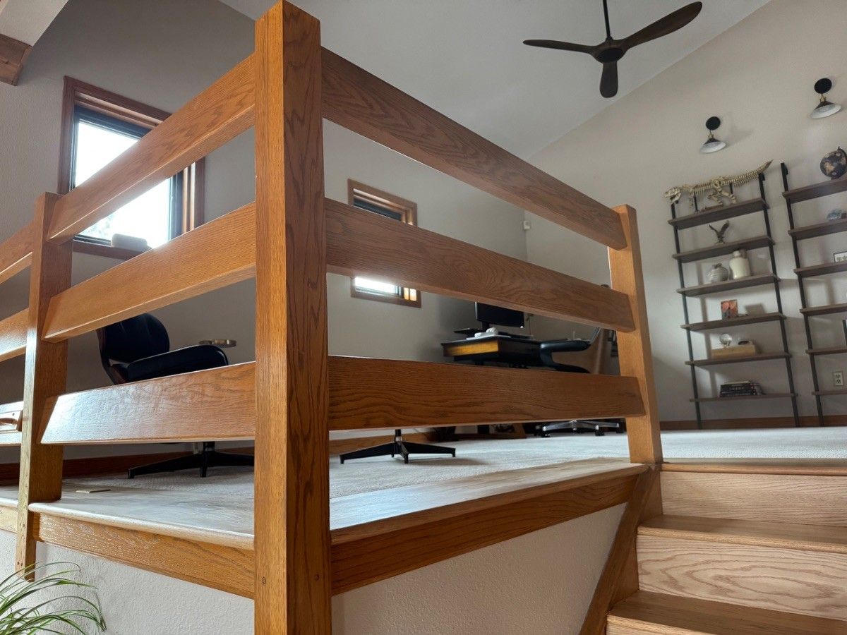 Existing horizontal wood guardrail and posts at a Colorado Springs 80904 staircase