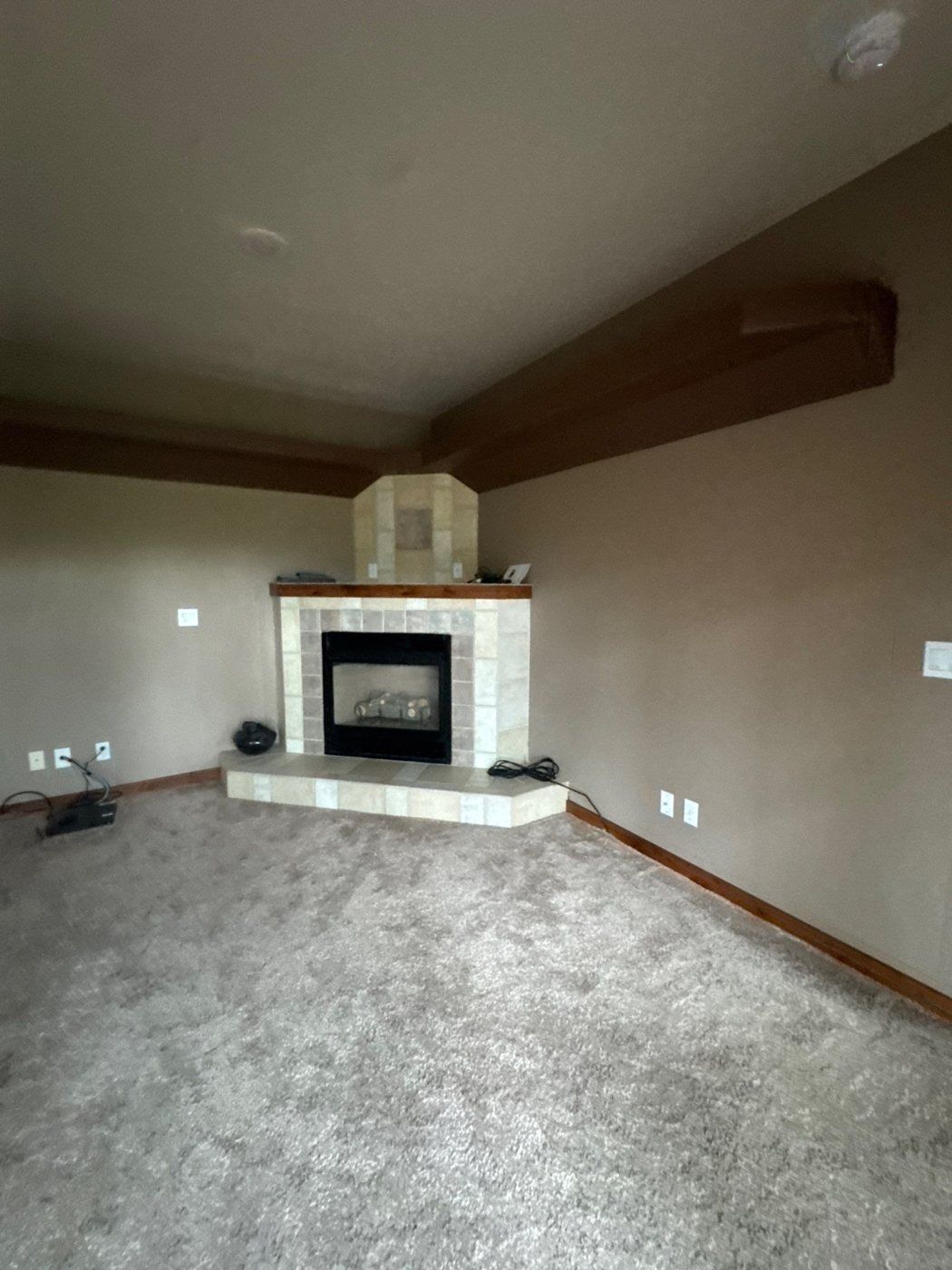 Living room fireplace, ceiling and existing surface marks in the Woodland Park home