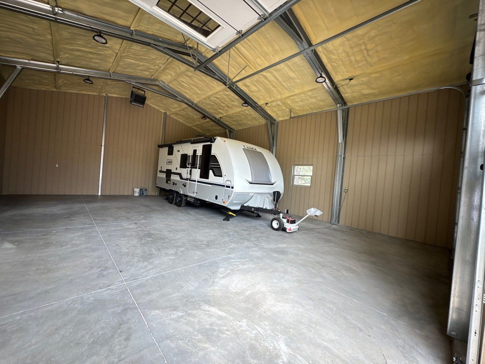 Open concrete floor and wall surfaces in the same Colorado Springs workshop estimate