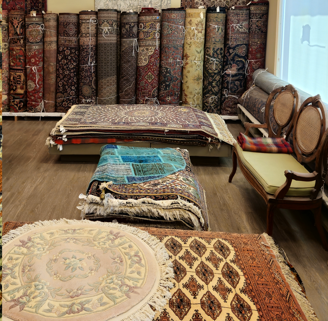 A bunch of rolls of carpets of different colors are stacked on top of each other.
